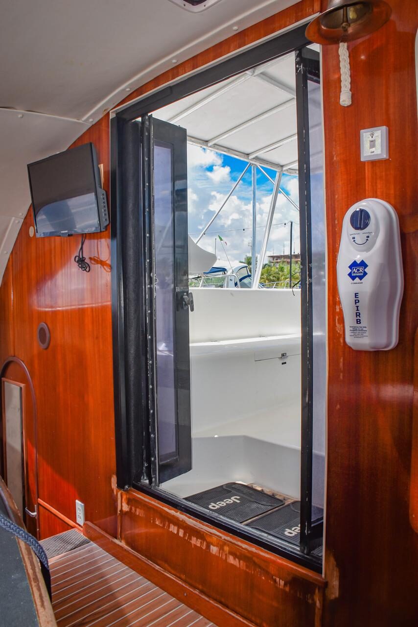 Indoor lounge with TV on the Miami Beach catamaran