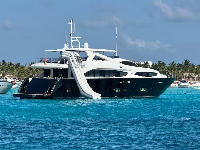 Luxury mega yacht with water slide in Cancun